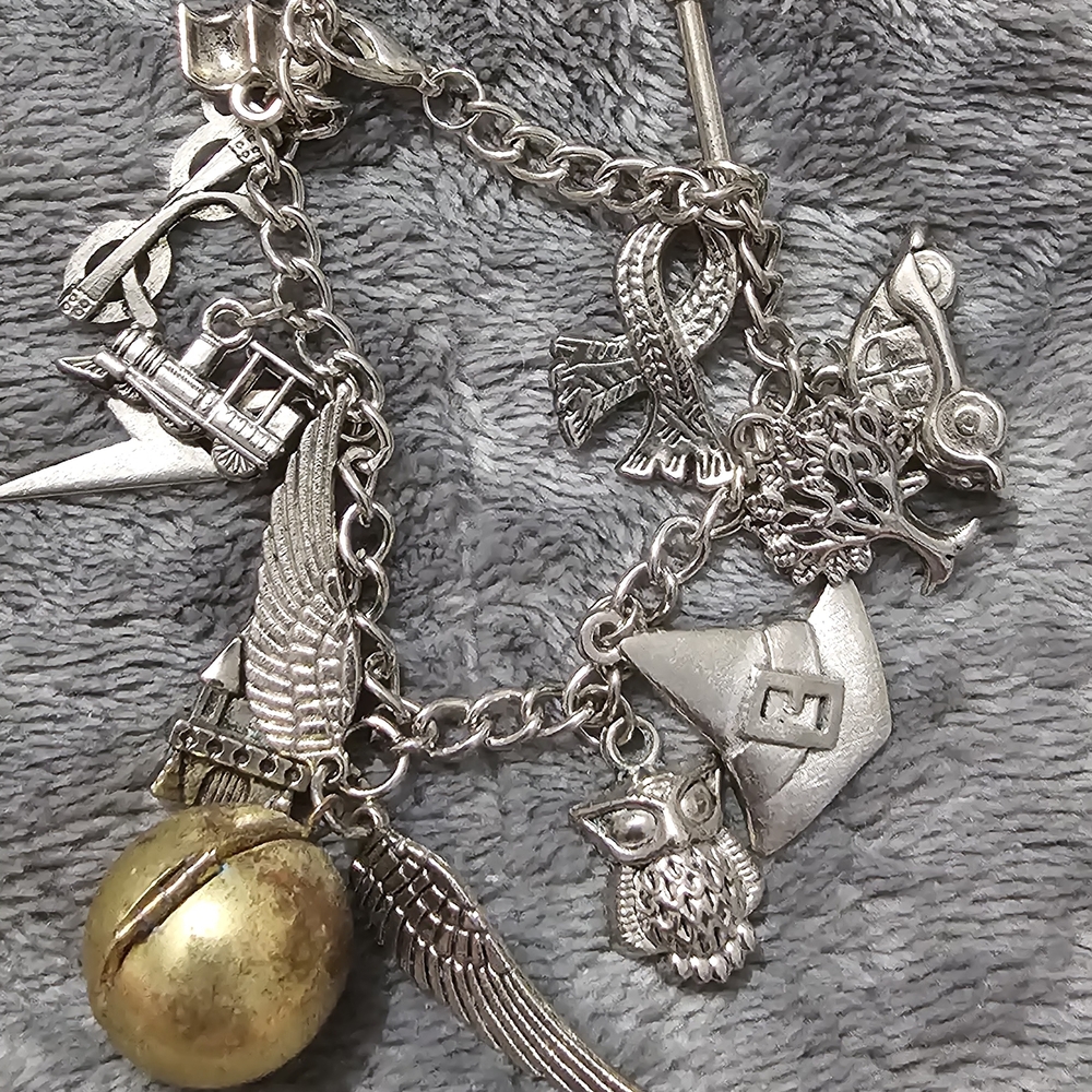 Silver Charm Bracelet with Gold Bell